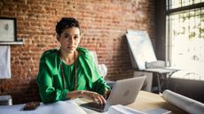 picture of a single woman working at a table