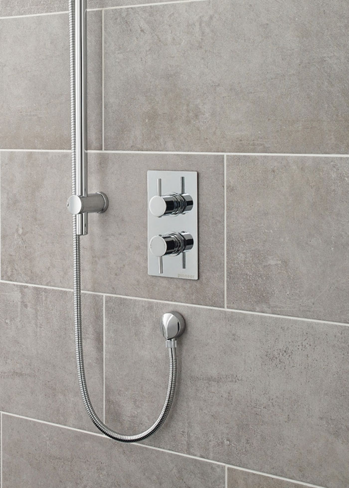 Deep clean chrome fixtures taps shower valves in shower enclosure with lemon juice and baby oil