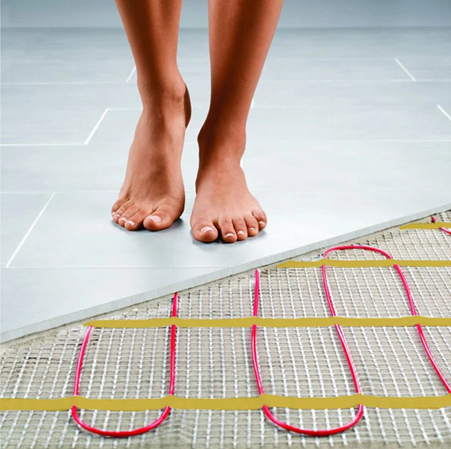 Woman Walking on Warm Bathroom Floor Heated with Underfloor Heating System